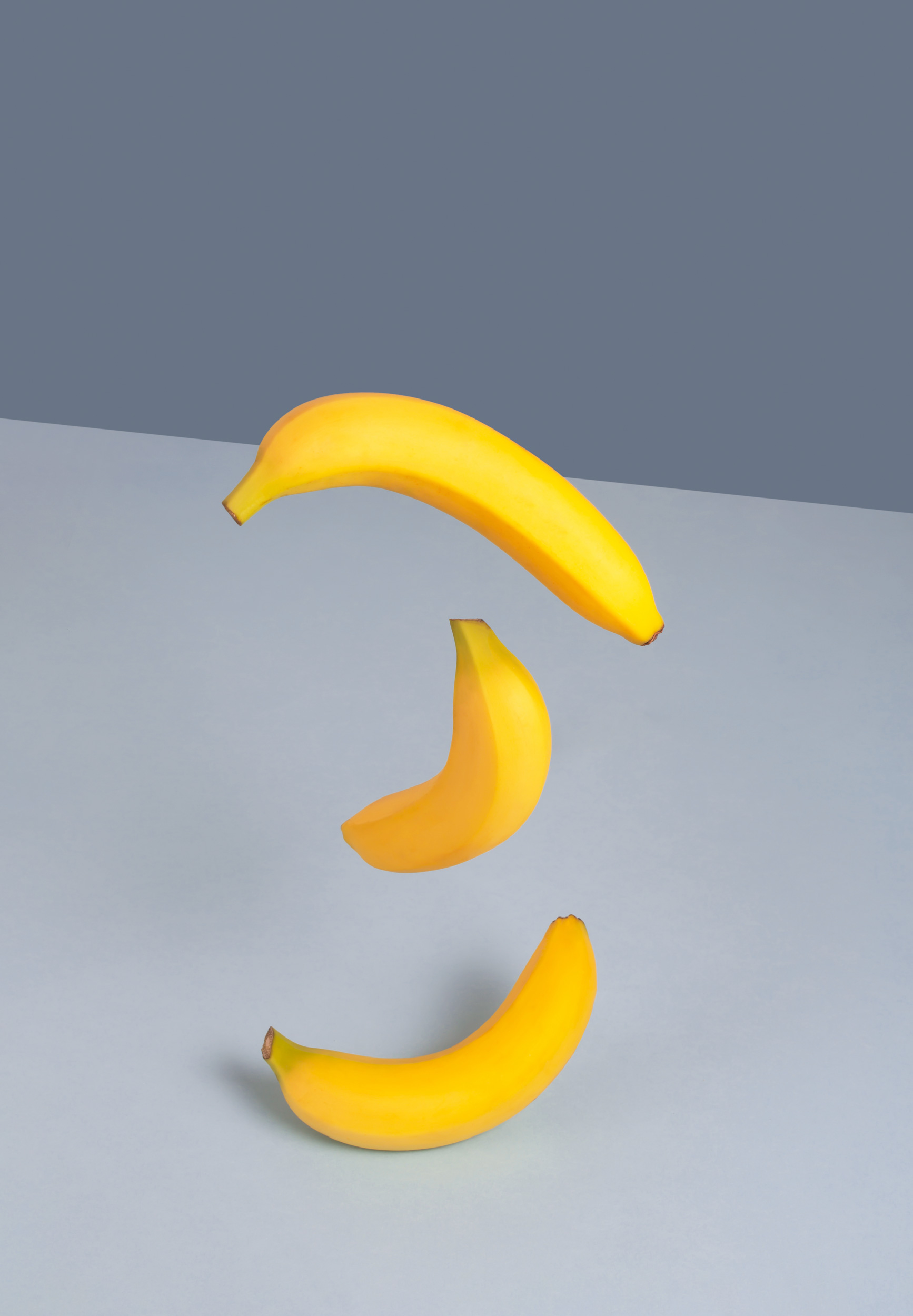 yellow-bananas-on-a-blue-background-minimalistic-2021-08-30-00-04-41-utc.jpg